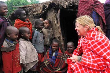 A picture of Suzette Munson ministering to Rwandan children.