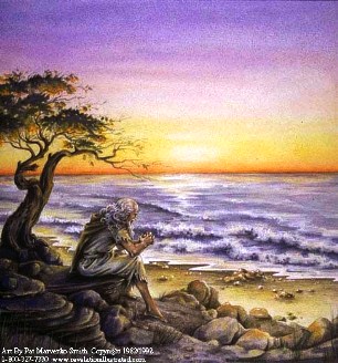 A picture of the Apostle John sitting on an island seashore.